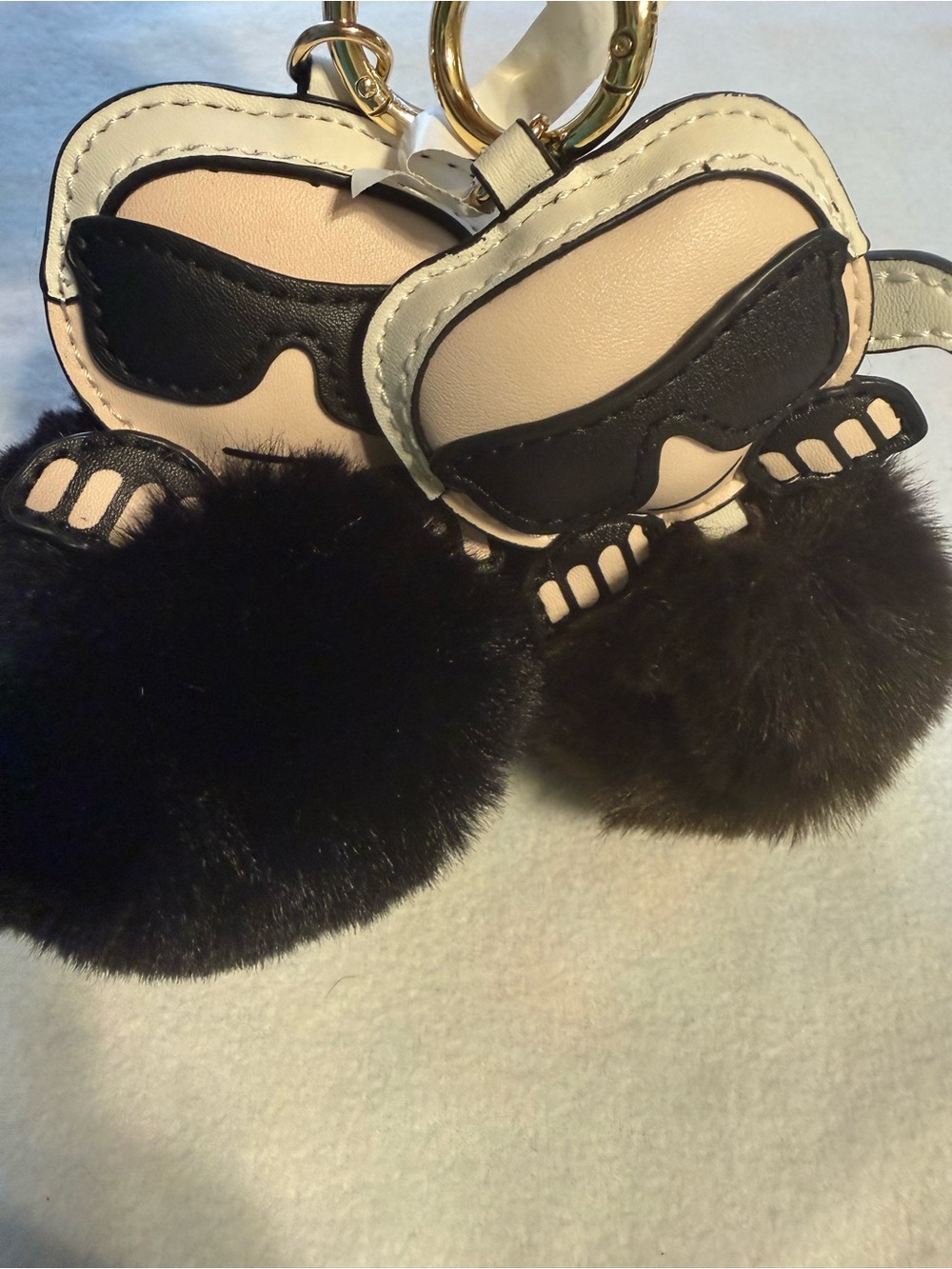 Two Karl Lagerfeld Bag Charms.